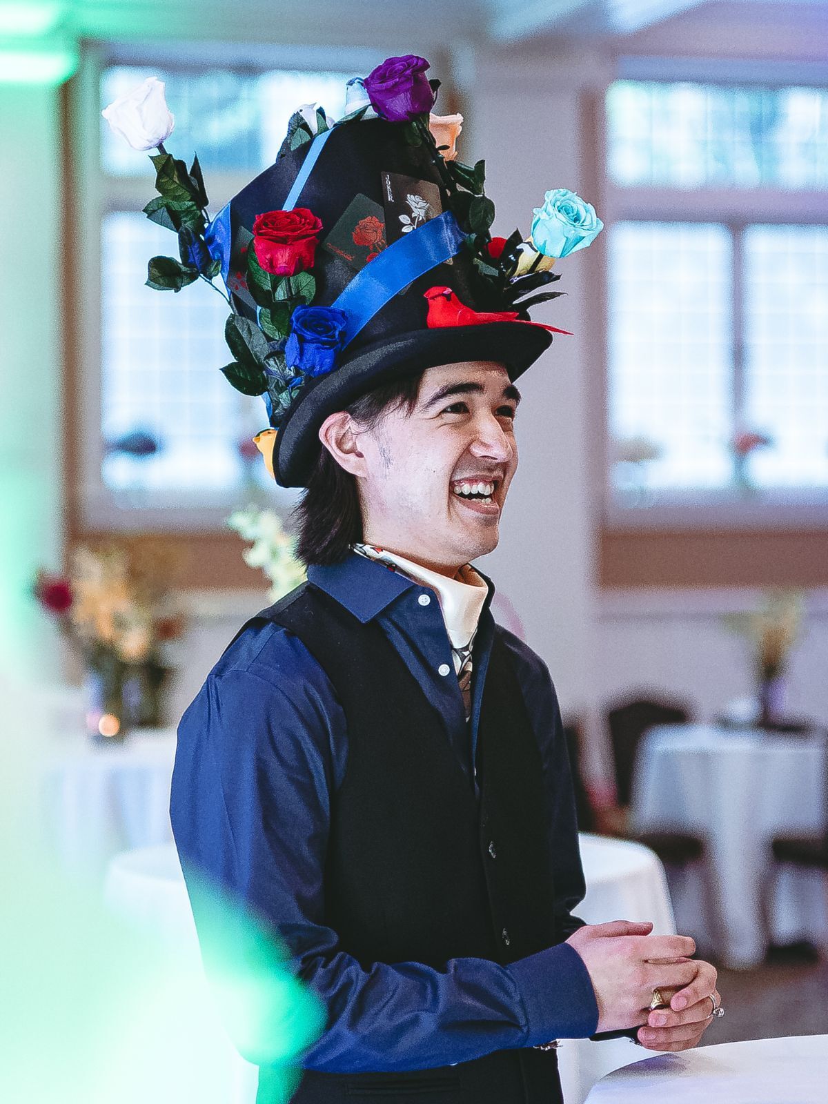 A member in an elegant gown descending the clubhouse staircase